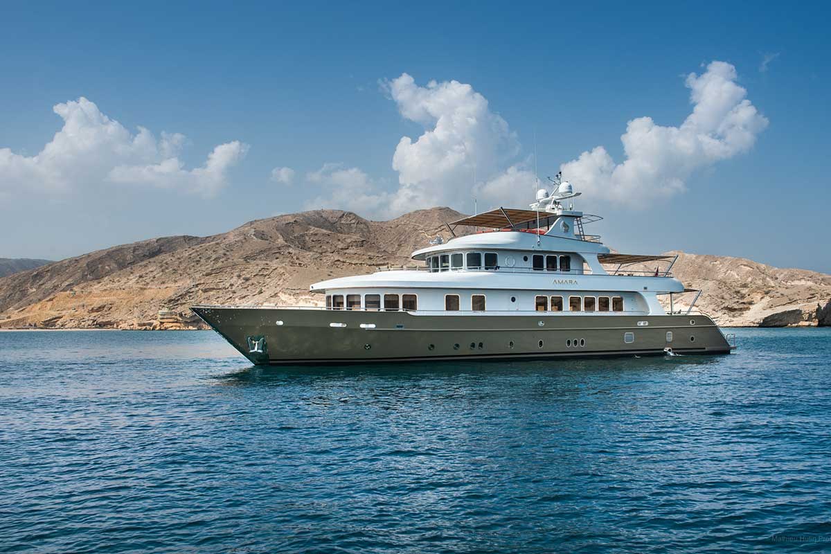 AMARA at anchor off the mountains of Oman