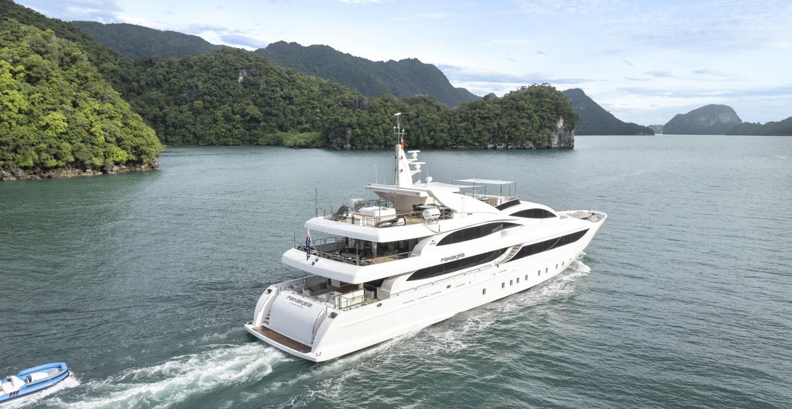 Superyacht anchored off a tropical island