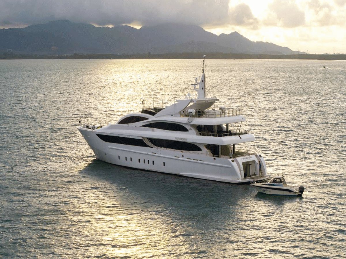 Superyacht at anchor at sunset
