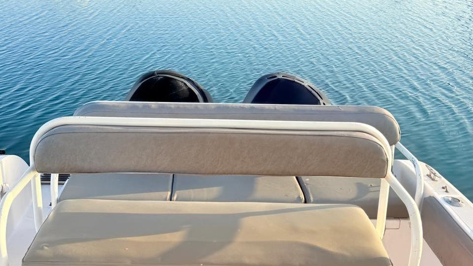 Stern seating and twin outboard engines on a fishing boat in Fujairah