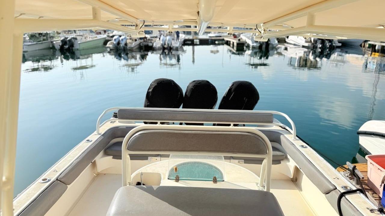 Twin outboard engines on the transom of a fishing boat in Fujairah