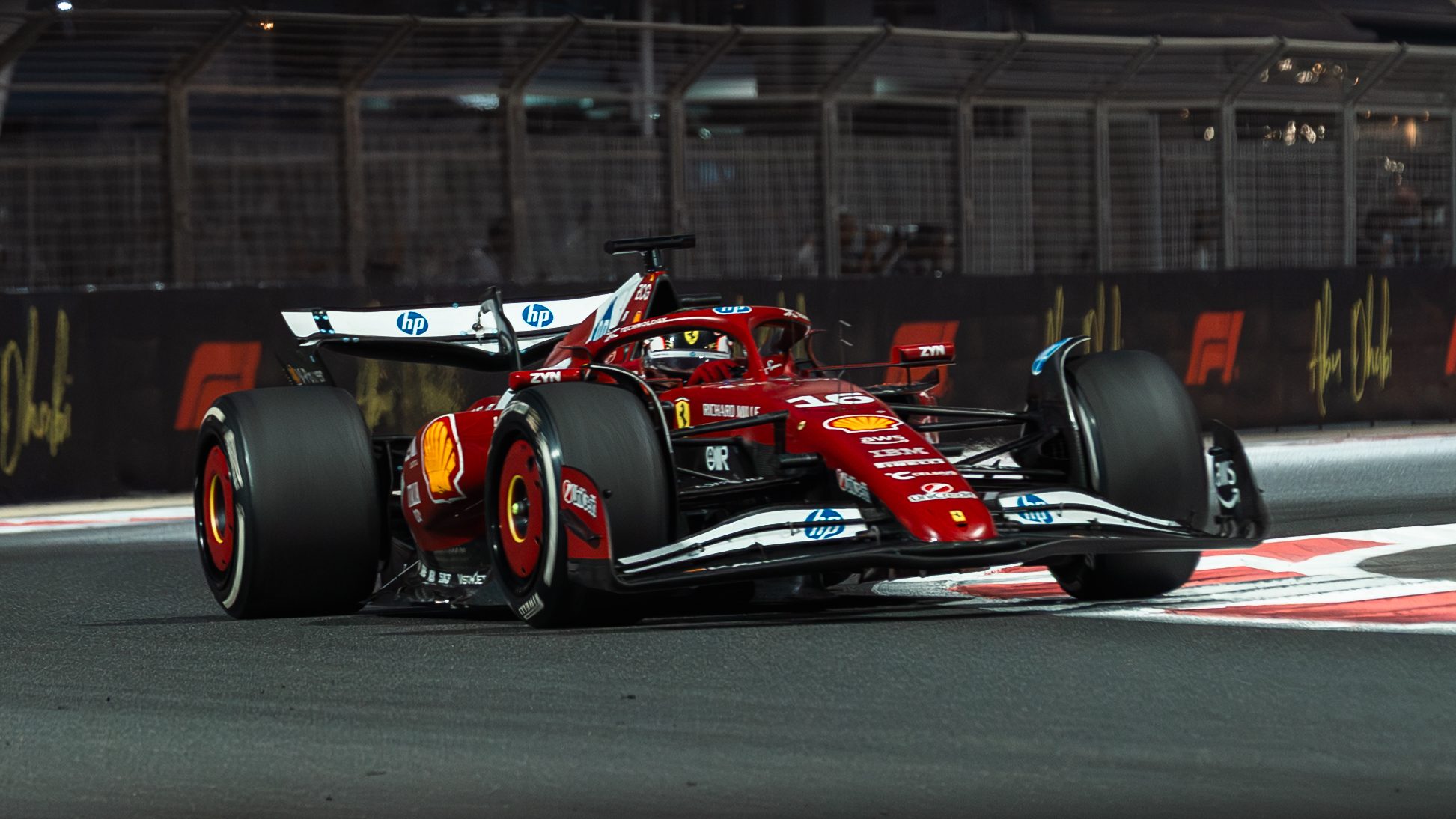 Ferrari at speed past the Yas Marina barriers