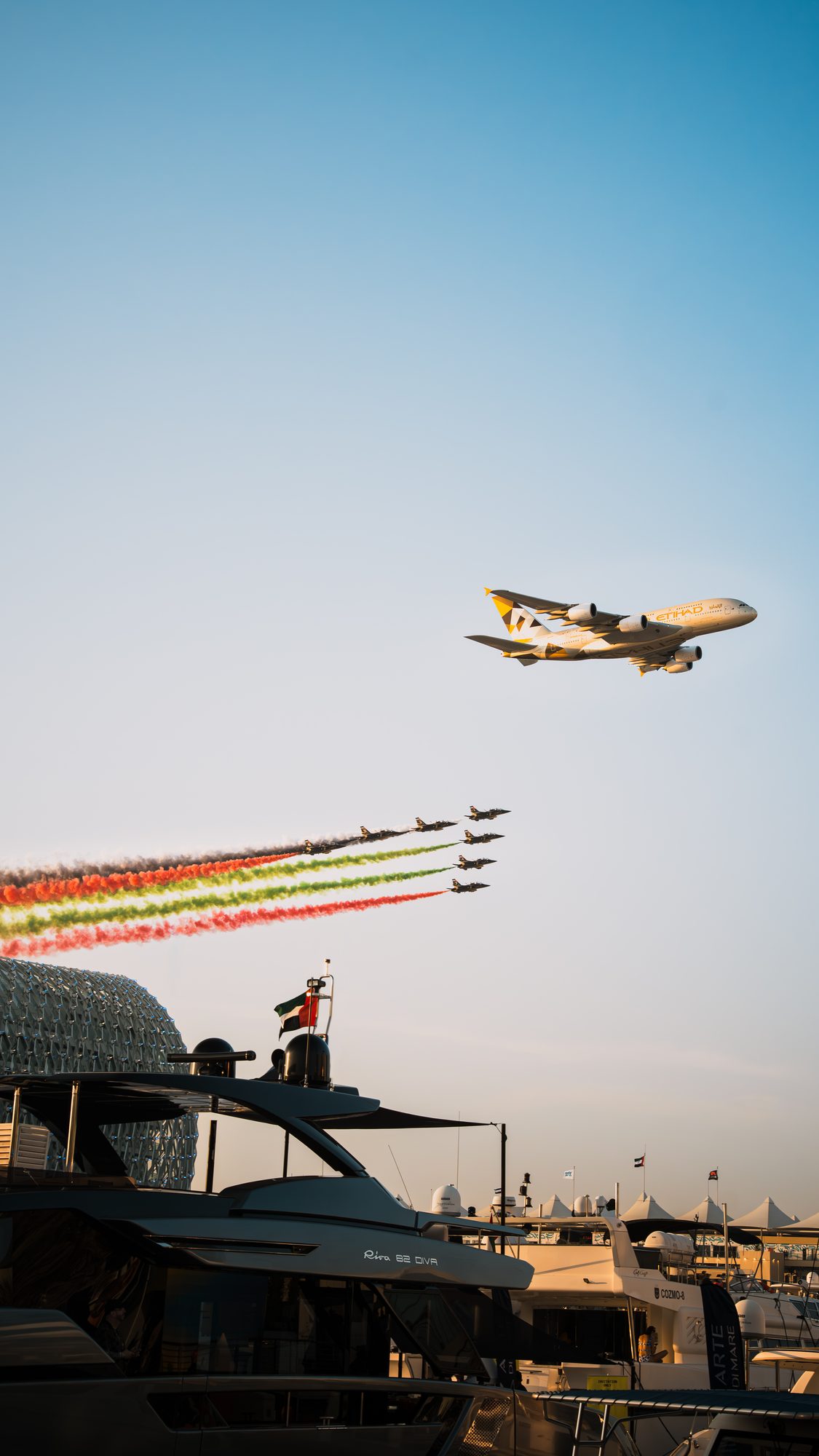 Airliner flypast over the marina at sunset